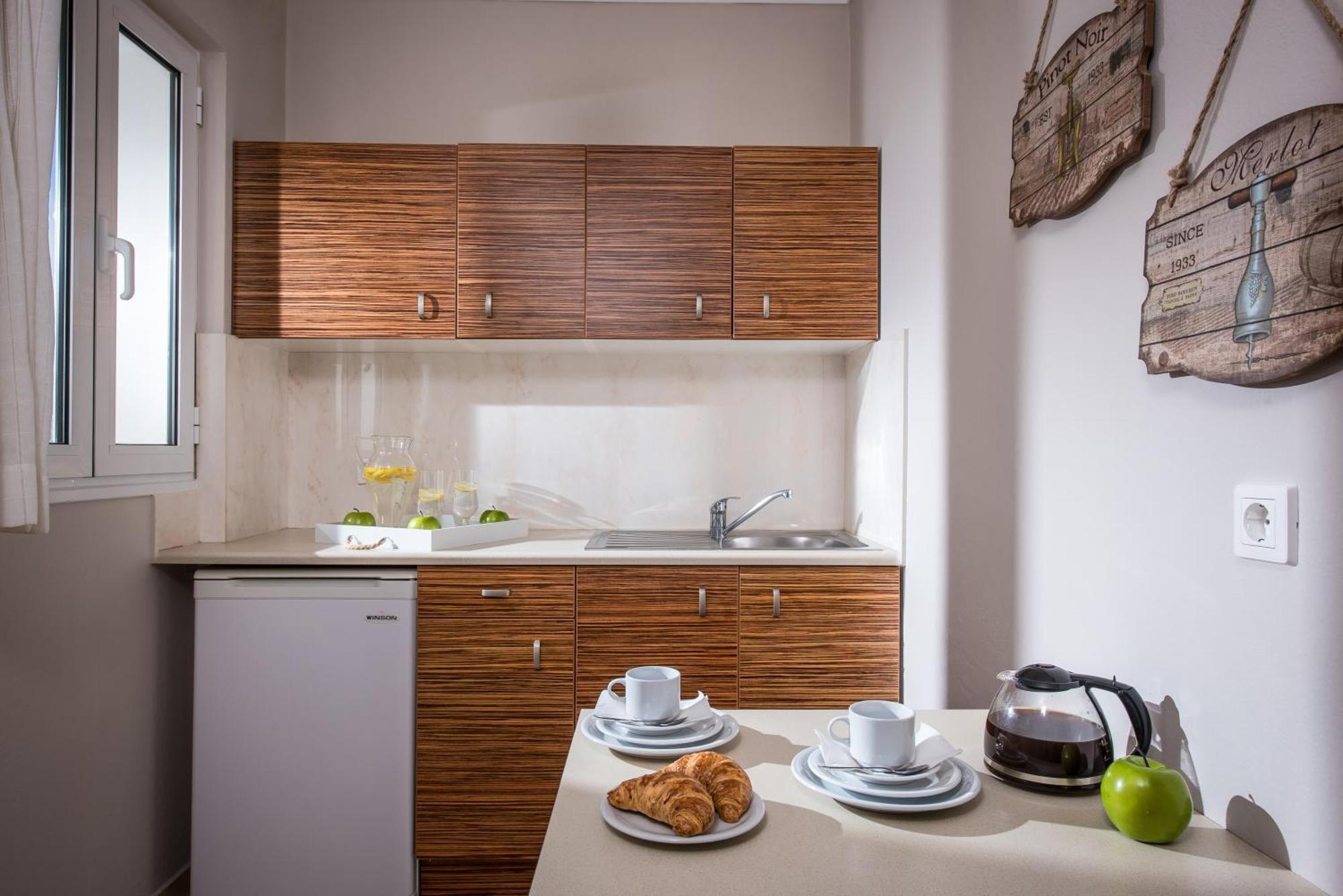 Ammos Boutique Apartments & Suites Mália Quarto foto